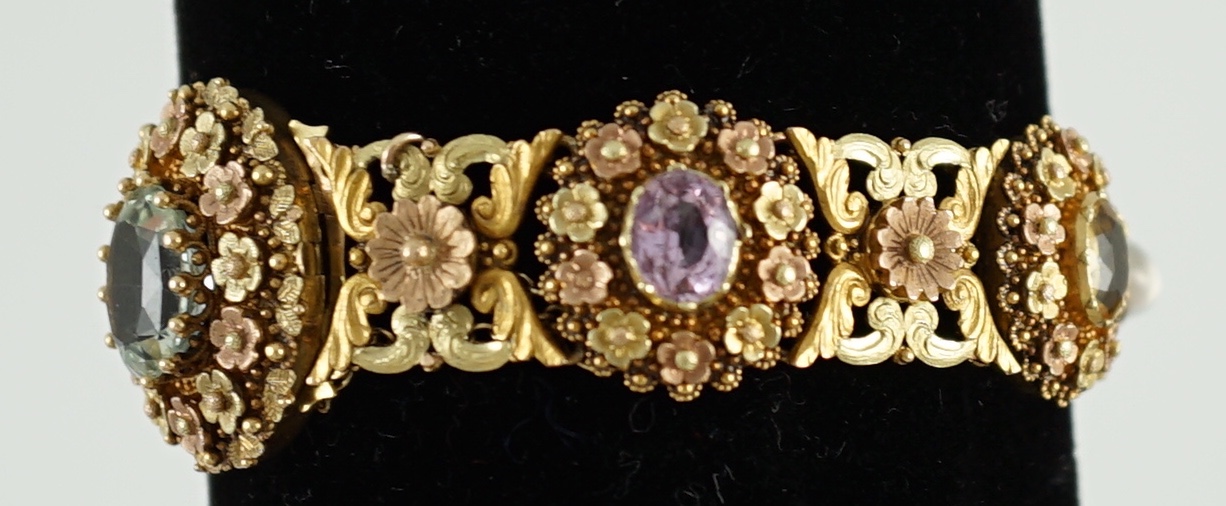 A 19th century pierced three colour gold, pink topaz, moonstone, citrine and aquamarine set bracelet.